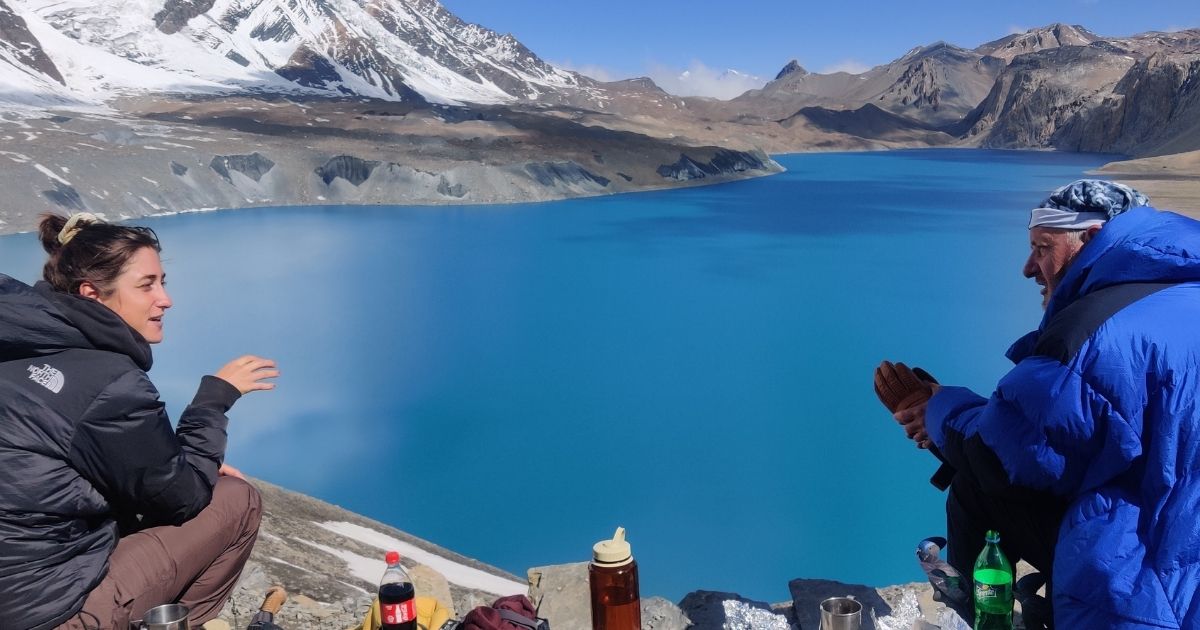 trekkers on tilicho lake
